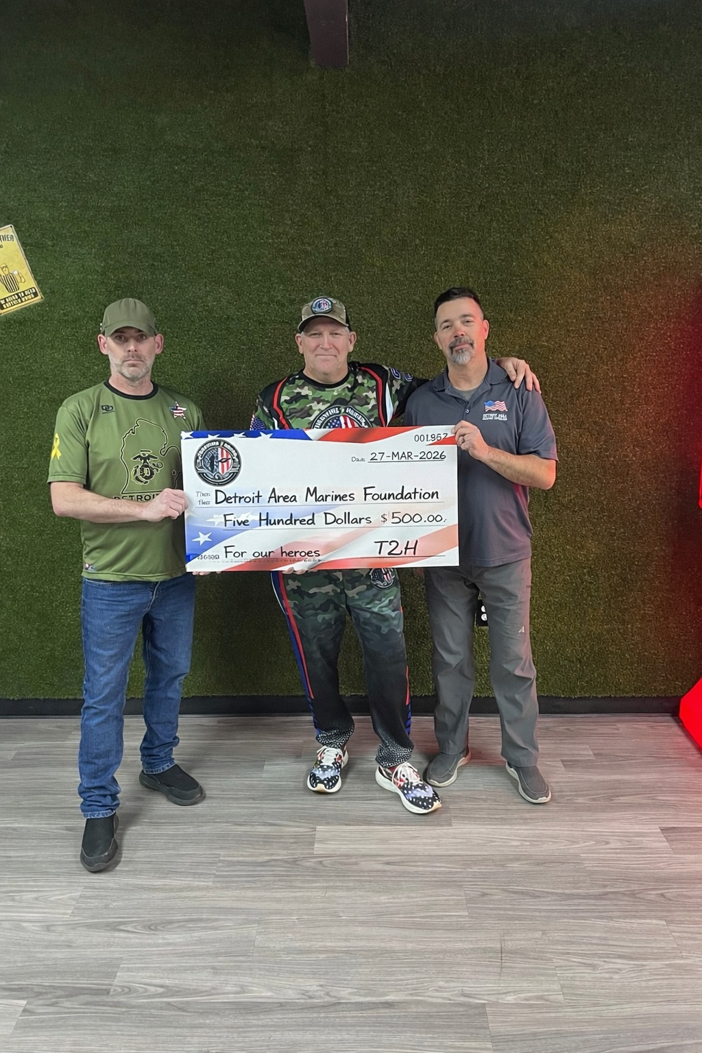 Throwing 2 Honor presenting a 500 dollar donation check to the Detroit Area Marines Foundation on March 28, 2026