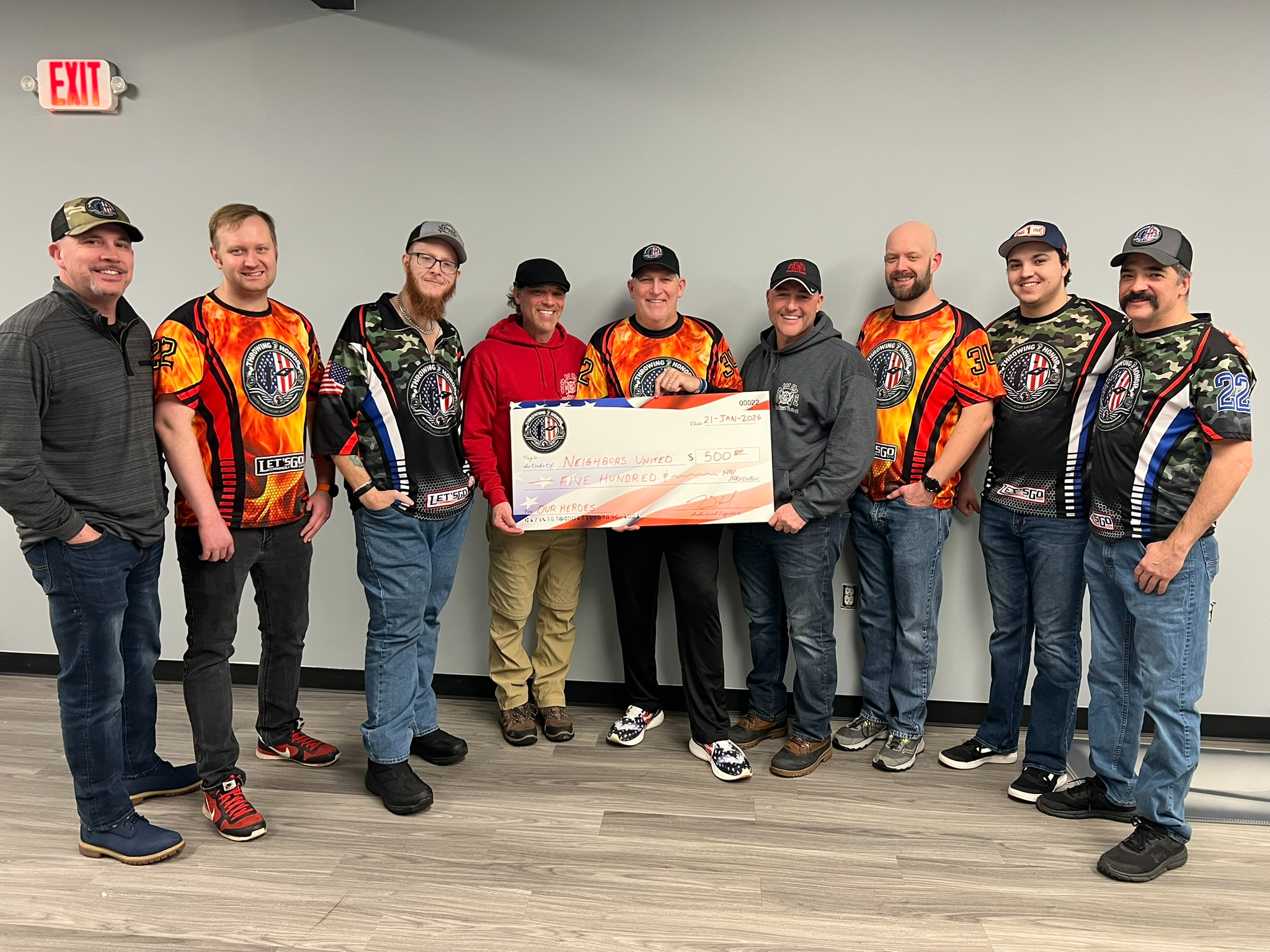 Throwing 2 Honor presenting a 500 dollar donation check to Neighbors United on January 21, 2026