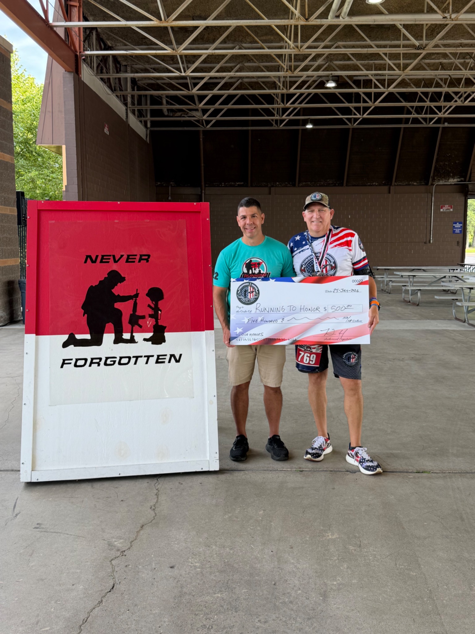 Throwing 2 Honor presenting a 500 dollar donation check to Running To Honor in July 2026